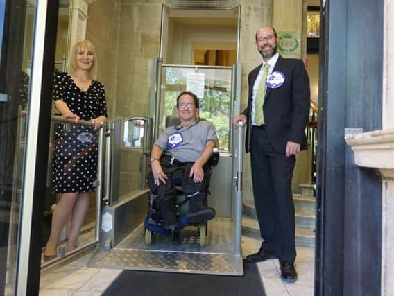Getting ready for the UCIs - Majestic Hotel general manager Matthew Hole with Disability Action Yorkshire chief executive, Jackie Snape, and Disability Action Yorkshire customer, Peter Webster.
