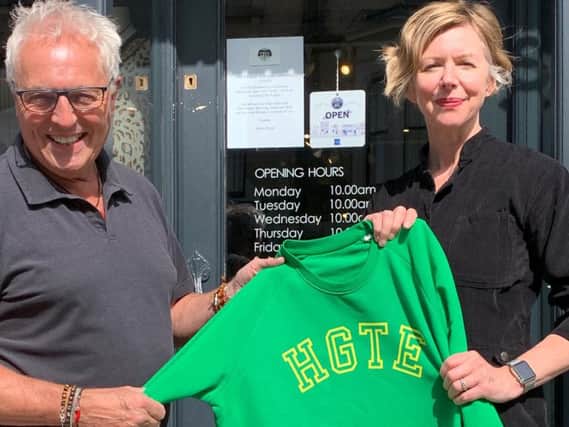 Supporting Harrogate, the UCIs and charity with a new sweatshirt - Sara Shaw, the owner of Violet Store,  and Paul Lown outside his shop Preyfour on Parliament Street.