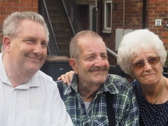 An emotional reunion: Michael Jaques with his brother Derek and sister Dot. Picture: Ashley Blackett.