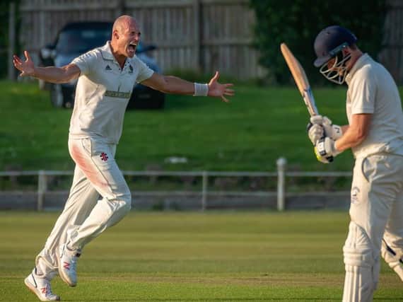 Harrogate CCs Tom Geeson-Brown celebrates after taking the final Scarborough wicket and wrapping up a crucial victory for his team. Picture: Caught Light Photography