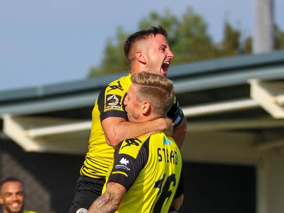 Josh Falkingham, left, congratulates Jon Stead after Harrogate Town took the lead against AFC Fylde, only for the goal to then be ruled out. Picture: Matt Kirkham