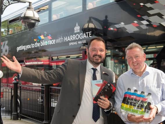 Bus boost during UCI cycling championships - Harrogate Water sales and marketing director Rob Pickering, right, with The Harrogate Bus Companys CEO Alex Hornby.