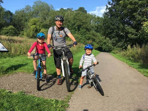 Richard Linford with daughter Jemima, six, and son Stanley, three, ready for the community bike ride.
