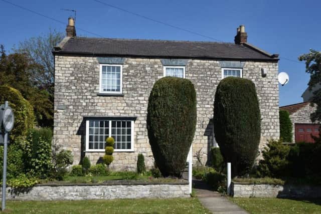 Snap up this attractive four bedroom double fronted stone country cottage at auction. Guide price £240,000.