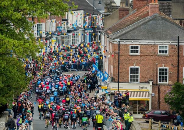 Date:29th April 2017.                                  Picture James Hardisty
TDY 2017 Stage 2..........Second race of the day the Mens race starting from Tadcaster. Pictured The start of the mens race, riding across the restored Tadcaster bridge which was damaged by the 2015 Boxing Day floods.