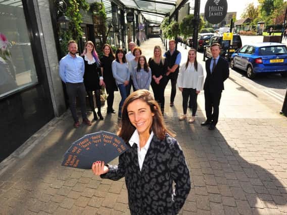 Launching Prince Albert Row in Harrogate - Sarah Woods of Woods Fine Linens with the new leaflet and business owners on the parade of shops. (Picture Gerard Binks)