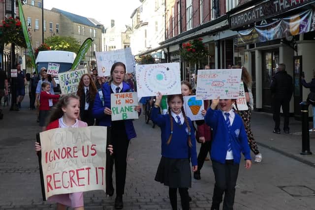 Young Harrogate climate change protesters march down Oxford Street.