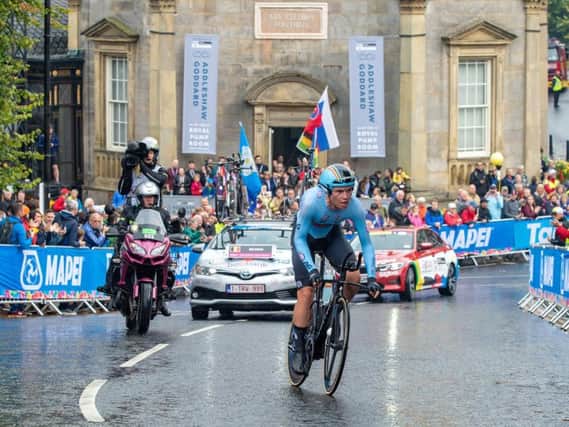 A Belgian cyclist passes Harrogate's Royal Pump Room Museum yesterday, Sunday during the Mixed Team Relay in the UCI World Championships 2019.