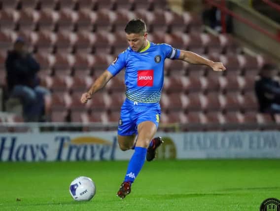 Harrogate Town skipper Josh Falkingham in action at Wrexham. Picture: Matt Kirkham