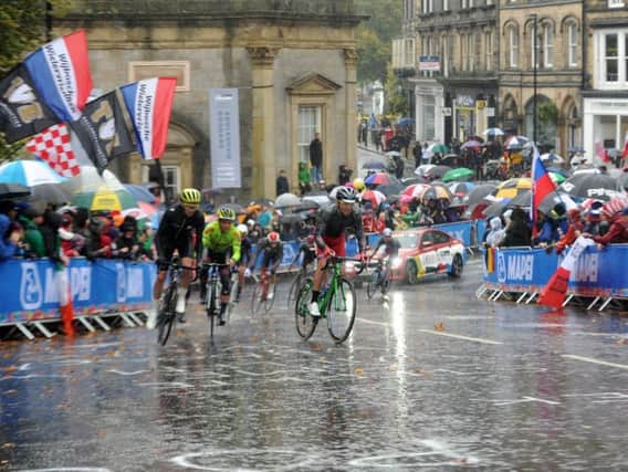 Spectators watch the mens elite road in heavy rain in Harrogate on day 9 of the UCI 2019 Cycling Road World Championship from Leeds to Harrogate . Picture Tony Johnson