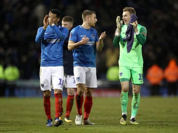 Ex-Harrogate Town goalkeeper Craig MacGillivray, right, and his Portsmouth team-mates will be visiting Wetherby Road in the FA Cup first round proper. Picture: Getty Images