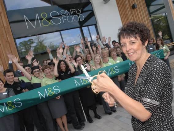 NADV 1406251AM2 Marks and Spencers opening. Store manager Andrea Watson prepares to cut the ribbon to open the new store. (1406251AM2)