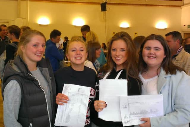 Lucy Hynes, Alice Quinn, Lena Picton, and Hannah Mcdonough  receiving their GCSE results from St Aidan's Church of England High School.