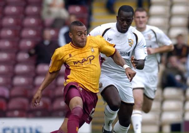 Town's Jake Speight, then at Bradford City, keeps the ball away from Port Vale's Anthony Griffith, his new teammate.