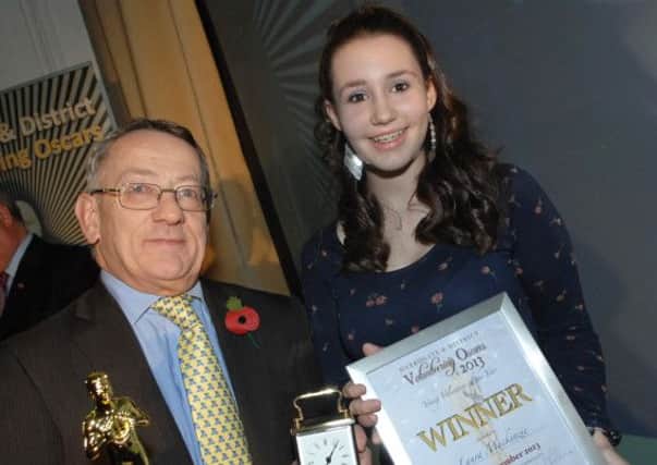 Philip Broadbank of Enid Taylor Ltd presents Laura Mckenzie with her 2013 Young Volunteer of the Year Award. (1311011AM10)