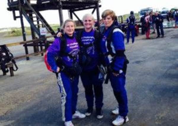 Zoe Hanson, Laura Thwaite, and Zoe Hurst on their skydive for Saint Michael's Hospice. (S)