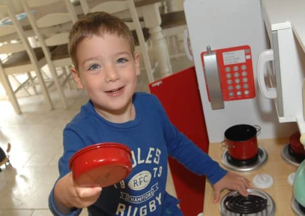 NADV 1408262AM6 Sabastian Skinner. Sebastian in his own play kitchen. (1408262AM6)