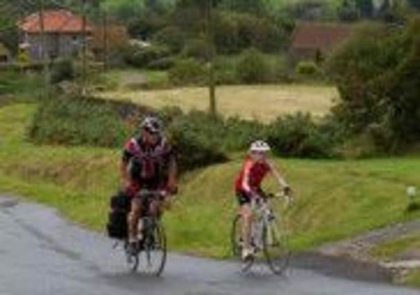 12-year-old Amy Warrington and her dad Adrian take on the coast to coast bike ride. (S)