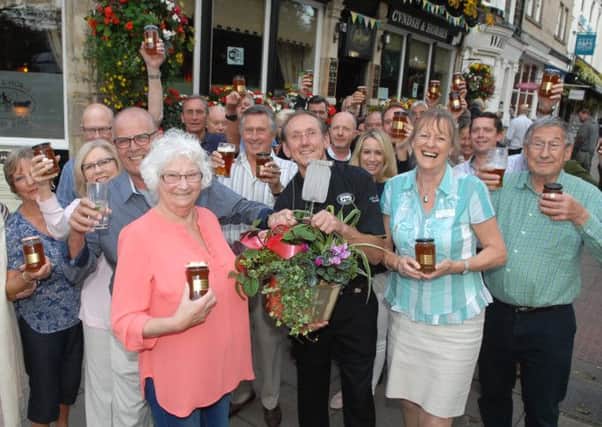NADV 1409094AM1 Sheila's marmalade. Sheila Margaret Farr with her husband Howard Cadman, the landlord of the Coach and Horses John Nelson, Alyson Wort of Martin House and regulars. Picture : Adrian Murray.(1409094AM1)