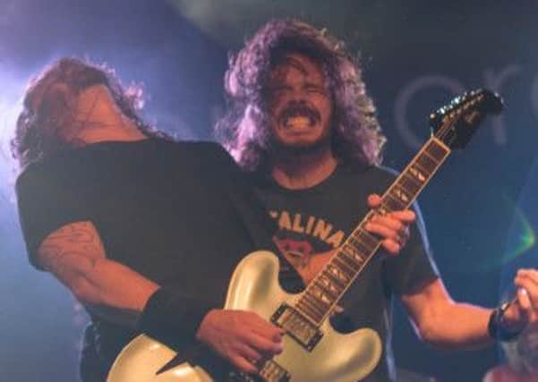 UK Foo Fighters Jay Apperley on stage with Dave Grohl in Brighton. (Picture by Kalpesh Patel)