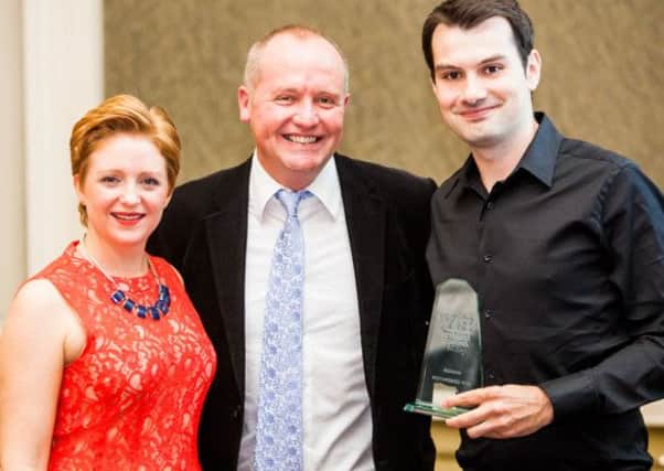 Illiya Vjestica collects his Next Generation award from Louise Turner of Awards Writers and Darren Shaw of BiY. (S)