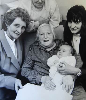 NAPB 1409301AM3 Abbott's new baby.  Kimberley Abbott as a baby with her great great grandma Sarah Jane Pullan, grandma Margaret Robinson, great grandma Doris Moorhouse and mum Diane.(1409301AM3)