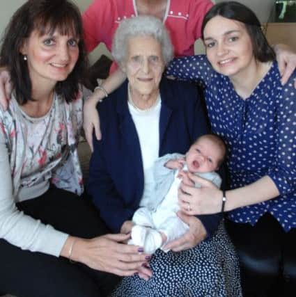 NAPB 1409301AM2 Abbott's new baby. 1 month old Charlie Scruton with his great great grandma Doris Moorhouse(89), grandma Diane Graham, great grandma Margaret Robinson and mum Kimberley Abbott(1409301AM2)