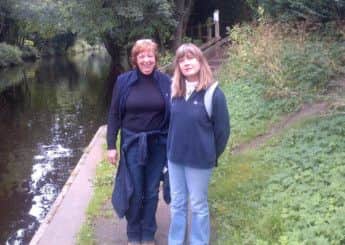 Angela is physically fit and enjoys walking, pictured with friend Cynthia Bray