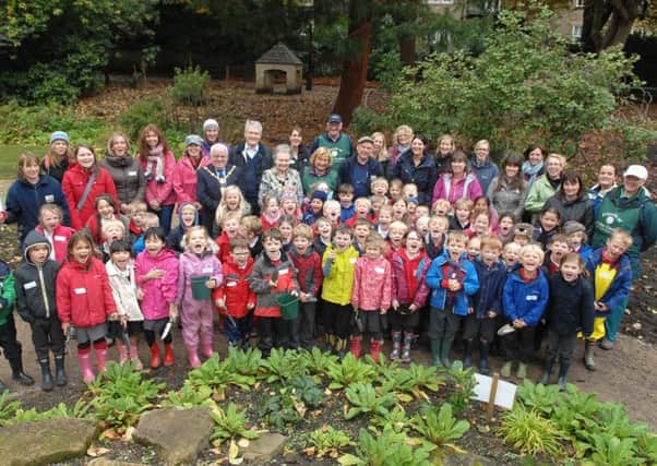 Year 2 children from Western Primary School with teaching staff, members of the  friends of the valley gardens The Mayor of Harrogate Jim Clark, The Mayoress of Harrogate Shirley Fawcett and Andrew Jone MP. who helped with the bulb planting.  (1410101AM1)