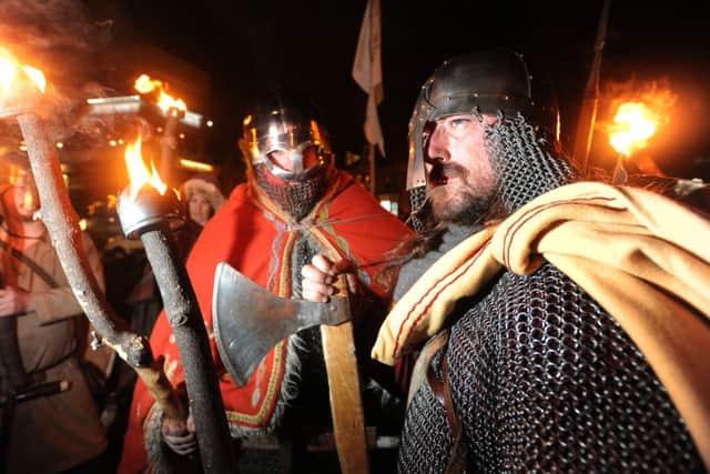 A troupe of Vikings lead a torch-lit procession through Harrogate to open the second Harrogate History Festival. Picture Bruce Rollinson