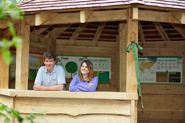 Inside Betty's new woodland learning shelter - RHS Harlow Carr curator Paul Cook with Bettys and Taylors' ethical projects officer Samantha Gibson.