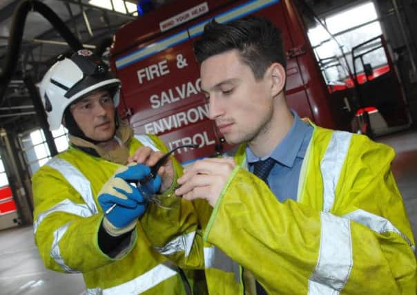 NADV 1411101AM12 Dan at Fire Station. (1411101AM12)