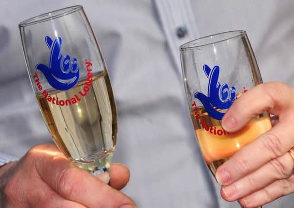 National Lottery champagne flutes as the Lottery will mark two decades of creating millionaires and supporting good causes when it whirs up its draw machine and brightly coloured balls today.Photo:  Rui Vieira/PA Wire