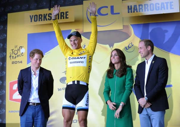 Marcel Kittell recieves the Yellow Jersey from the Duchess of Cambridge, pictured with Prince Harry and the Duke of Cambridge.
Marcel Kittell won the first stage of the 2014 Tour de France in Harrogate from Peter Sagan after Mark Cavendish crashed at the bottom of Parliament Street.  5 July 2014. Picture Bruce Rollinson.