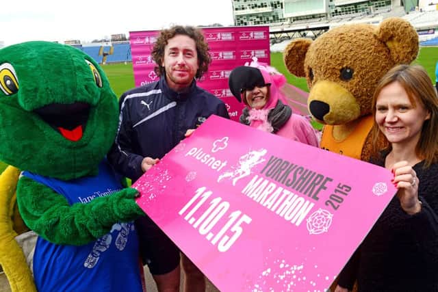 Yorkshire's Ryan Sidebottom with Caroline Richardson of sponsors Plusnet, and mascots from many of the partner charities, at the launch of the Yorkshire Marathon 2015.Picture Scott Merrylees SM1006/51a