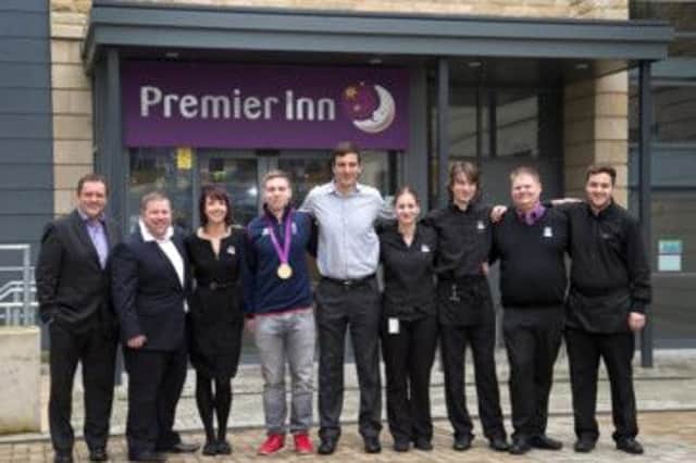 Olympic gold medal-winning cyclist Philip Hindes MBE with the Premier Inn team yesterday. (S)
