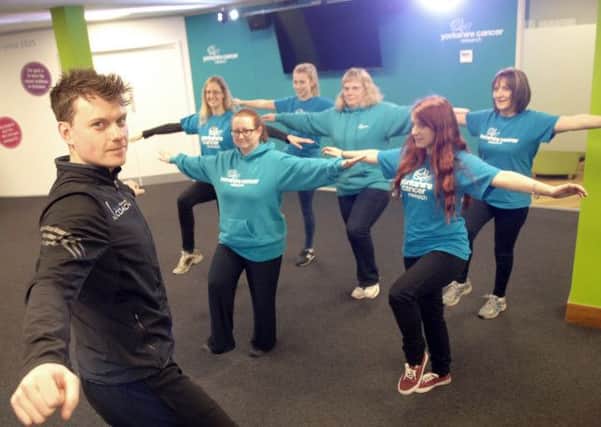 NADV 1501272AM2 Yorkshire Cancer Research office.  Personal trainer Dave Millea of Fluid Training puts YCR staff through their paces. (1501272AM2)