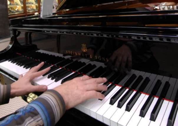 10th July 2007   Pianist Kevin James  playing a Steinway piano from  Bestrode Pianos in the Victoria Quarter in Leeds.