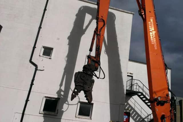 High reach machine used to demolish the Beales department store this weekend.