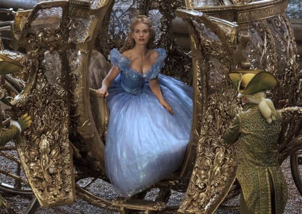 Film Still Handout from Cinderella, Pictured: Lily James as Cinderella, Picture credit should read: PA Photo/Jonathan Olley/Disney. WARNING: This picture must only be used to accompany PA Feature FILM Reviews.