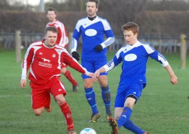 Kirk Deighton's Neil Nicholson(blue) and Kirkby Malzeard's Leam Horton (red). (1501101AM3)