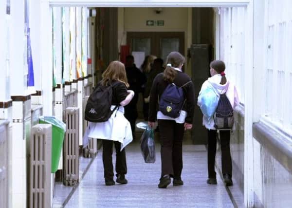 School classroom stock
Pupils walk along a school corridor. 9 July 2002