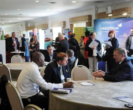 Wallace Sampson of Harrogate Borough Council and Gary Verity of Welcome to Yorkshire in conversation with one of the business mentors.