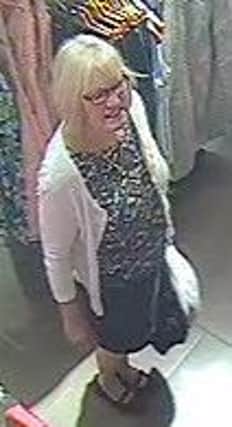 Police release CCTV images of a woman in connection with the theft of a pair of blue suede shoes from Monsoon on James Street, Harrogate. (S)