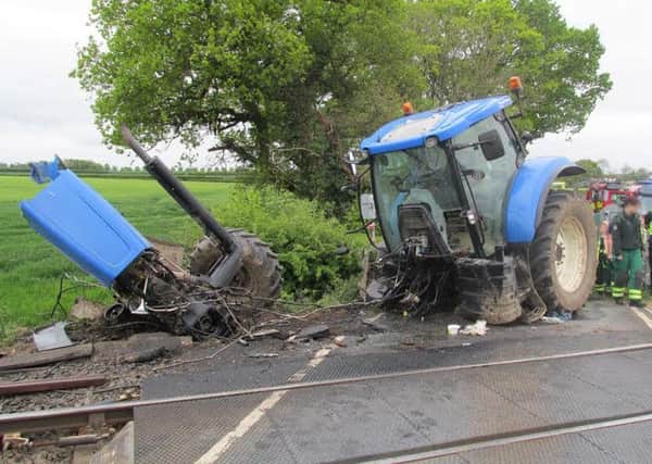 Tractor sliced in half by train at Oakwood Farm station (s)
