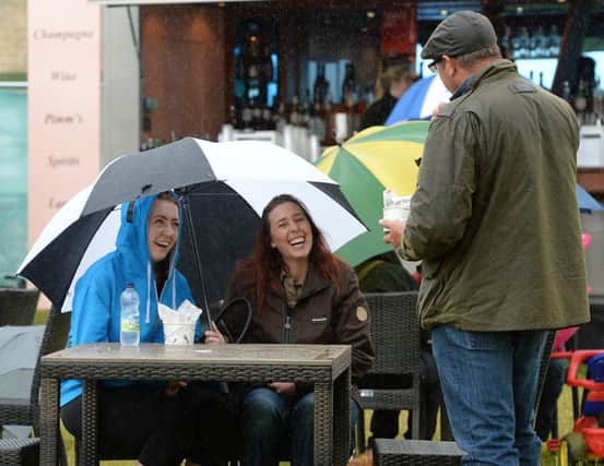 People enjoy themselves despite the rainy weather at Bramham International Horse Trials. Picture: Anna Gowthorpe