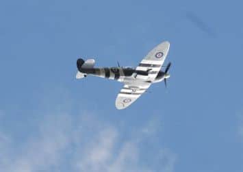 A flypast by a real Second World War Spitfire at 40's Day at Valley Gardens in Harrogate piloted by Squadron Leader Justin Helliwell Battle of Britain Memorial Flight.