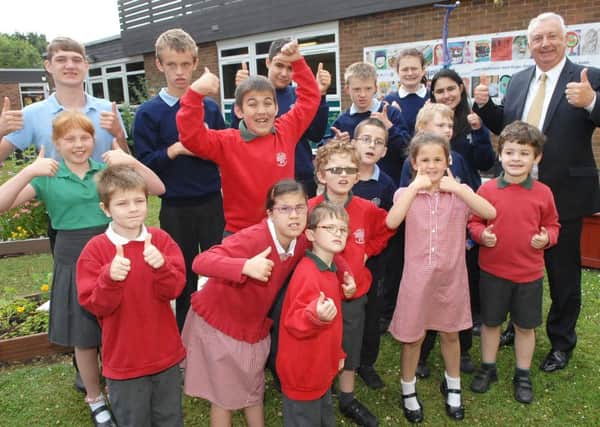 Pupils at The Forest School and headteacher Peter Hewitt celebrate the schools outstanding Ofsted report. (1507071AM1)