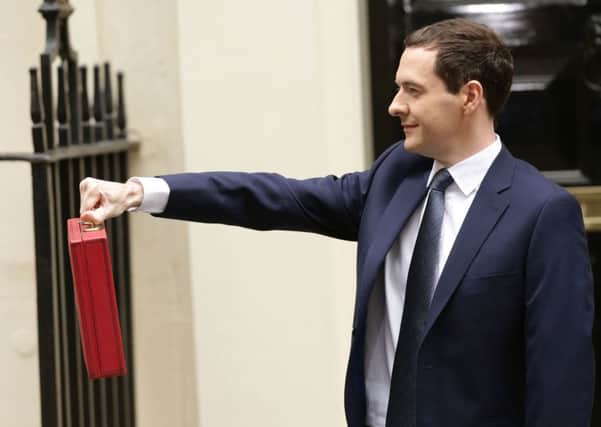 Chancellor of the Exchequer George Osborne  outside 11 Downing Street, London, before heading to the House of Commons to deliver his first Tory-only Budget. PRESS ASSOCIATION Photo. Picture date: Wednesday July 8, 2015. See PA story BUDGET Main. Photo credit should read: Yui Mok/PA Wire