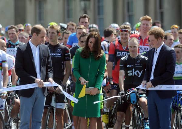 Prince William, pictured left with the Duchess of Cornwall and Prince Harry, at Harewood House during the 2014 Tour de France.